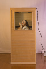 Hemlock Mini one person far infrared door on the Right of the indoor sauna room